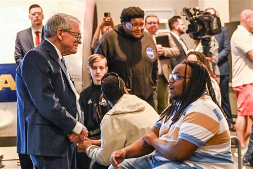 Official meets with student. 