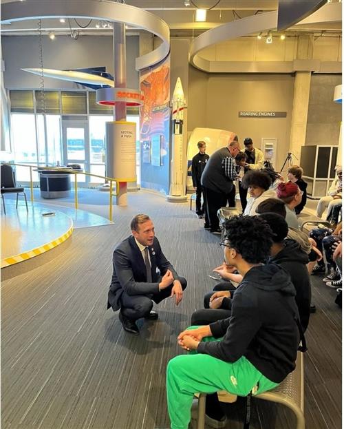 Official meets with student. 