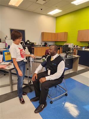 Dr. Morgan getting blood pressure checked