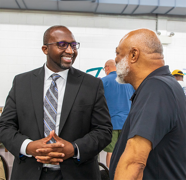 Dr. Morgan talks with Minister